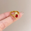 Adjustable gold butterfly ring featuring a ruby-red oval gemstone and white cubic zirconia - Oval Ruby