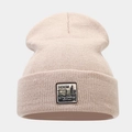 Macro detail of beige knit beanie with a vintage branded patch and textured yarn weave - M (56-58cm) / Beige