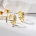 Close-up of golden quilted texture earrings with dimensions 1.3cm diameter for unisex - EH785 Gold Medium Quilted Hoops