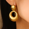 Elegant gold drop earrings in a double loop figure-eight design worn by a model - 18K Gold Plated Stainless Steel Gourd Shape Earrings (3761)