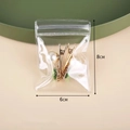 Transparent PVC jewelry seal bag sized 6x8cm showing stored gold and pearl hair clips - 6x8cm/26 Silk Thickness / Clear