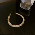 Elegant gold bracelet with AAA square cut cubic zirconia crystals on a dark background - Rectangular 2.5*5mm / Gold