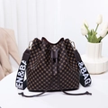 Classic brown monogram bucket bag with drawstring closure and wide designer shoulder strap - Coffee