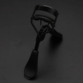 Professional black eyelash curler with built-in comb for natural curling and definition - Electrophoresis Black Curler with Comb Black Duckbill Handle Black Rubber Pad