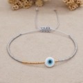 Dettaglio bracciale con perline Miyuki, occhio blu e cordino intrecciato grigio regolabile - Grigio (MI-B200498D)