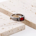 Macro shot of silver cable ring with rectangular red gemstone in vintage pavé setting - US 8 / Steel with Red Zirconia