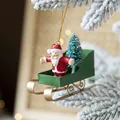 Slitta nordica in ferro verde con ciondolo Babbo Natale, misura 10x3,5x7,5 cm - Stile Slitta con Babbo Natale