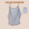 Close-up of light blue cotton nursing cover with adjustable strap and storage bag - Grey Blue