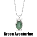 Detail of silver owl necklace featuring a large oval green aventurine stone inlay - Green Aventurine