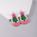 Detailed handmade beaded Christmas earrings with pink tree and bell on a stone base - Pink Green Christmas Tree