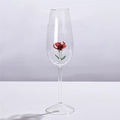 Double-walled glass shot cup with a red rose flower and green leaves inside - Red Rose Champagne Glass