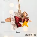 Close-up of resin angel tree ornament with star details, 5cm x 7cm size and jute rope - Style B Red Dress with Star