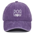 Detail of DOG MOM white embroidery on a washed dark purple cotton baseball cap texture - Purple