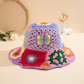 Close-up of handmade crochet bucket hat featuring colorful floral patchwork patterns - One Size / Multicolor Granny Square Basin Hat
