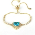 Adjustable gold heart bracelet with blue zircon stone and sparkling halo setting - Light Blue
