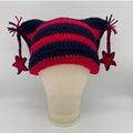 Handmade red and blue striped cat ear beanie with star tassels on a model stand - Navy Red Stripes