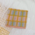 Kids' warm knitted scarf with pink and blue checkered pattern and yellow accent stripes - Pink Plaid