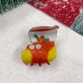 Detail of Christmas stocking hair claw clip with red glitter resin on festive snow - Christmas Sock
