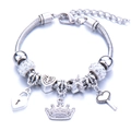 Detail view of silver bead bracelet with crown, heart lock, and star charms with crystals - White