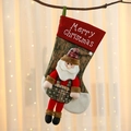 Detailed close-up of a festive Christmas stocking with Santa Claus and embroidery - Santa Claus
