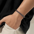 Detailed macro view of rainbow plated wheat chain bracelet with iridescent metallic finish - Rainbow Twisted Chain / Rainbow