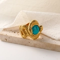 Vintage 18k gold snake ring featuring turquoise stone on beige stone pedestal - US 7 / Gold Turquoise