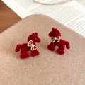 Detail of red flocked pony earrings with golden bow and pearl accent on display - Silver Pin-Red Pony Style