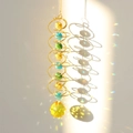 Detailed view of 3D spiral wind spinner with colorful crystals casting prism light - Gold Spiral Golden Yellow Crystal Ball