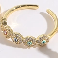 Anillo dorado ajustable con cuatro motivos de ojo turco en esmalte de colores y circonia - Estilo Circón Ojo de la Suerte