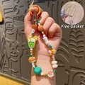 Dragonne de téléphone thé au lait avec perles en résine colorées et anneau de fixation orange - Thé au Lait - Chaîne de Téléphone Dopamine