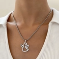Pendente angelo minimalista in argento su una catena box in acciaio inossidabile - Angelo Cavo Color Acciaio (9649)