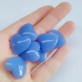 Set of blue natural crystal heart ornaments held in hand for Valentine gift - Blue