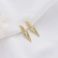 Golden arrow pendant charms with white zircon inlay on white textured fabric background - Spearhead Arrow Style (H-5667) / Gold