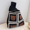 Detail of a black and white checkered knit tote bag with cute brown bear patterns - Black Four Bears
