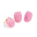Detailed view of handmade gold hammered rings with irregular pink crystal stone inlay - Pink