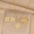 Macro shot of gold plated necklace and earrings set with white floral zircon pendants - Gold-White Set