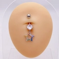 Macro shot of silver belly ring with a rainbow star pendant on a silicone model - Pentagram Shape (JE0795B)
