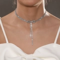 Bowknot rhinestone choker necklace with sparkling tassels shown on a model - Silver Rhinestone Bow Tassel Choker