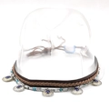 Detail view of ethnic hat band with turquoise beads and vintage metal charms - 20 Blue Faux Gemstone