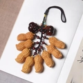 Chinese style keychain with realistic wooden peanuts and dark beads on vintage book - Peanut Cluster Persimmon Perfection