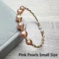 Detail of pink pearls on 14K gold filled wire wrapped handmade cuff bracelet - Pink Pearl