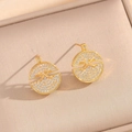 Golden round stud earrings with cross design and pave cubic zirconia in a jewelry box - Gold Stud Earrings (8915)