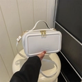 Minimalist white suitcase-style box bag with gold zipper and adjustable crossbody strap - White