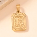 Detailed macro view of a gold square letter F pendant with polished metal texture - Letter F