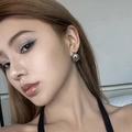 Triple-layer C-shaped silver metal hoop earrings with elegant twisted texture on model - Silver