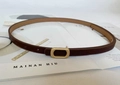 Detail of slim brown leather belt with matte gold buckle on a minimalist lifestyle background - Pearl Gold Short Hollow Buckle / Coffee