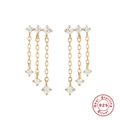 Macro detail of 925 sterling silver tassel earrings with golden finish and clear crystals - Triple Tassel Chain / Gold-Tassel Chain