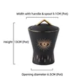 Matte black ceramic Evil Eye spice jar with gold trim and mythological eye design - Black Eye Sugar Pot