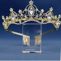 Elegant gold bridal crown with sparkling crystal rhinestones on a dark blue background - KC Gold Clear Rhinestone
