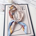 Detail of silk-like satin square scarf featuring chain prints and checkered patterns - French Blue Pink Plaid